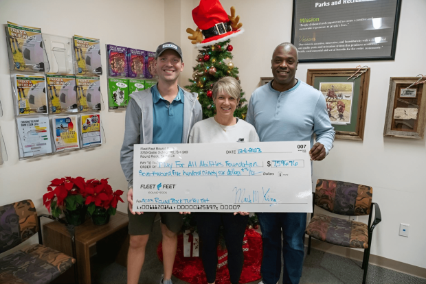 Fleet Feet Makes Charitable Donation to the Play for All Foundation
